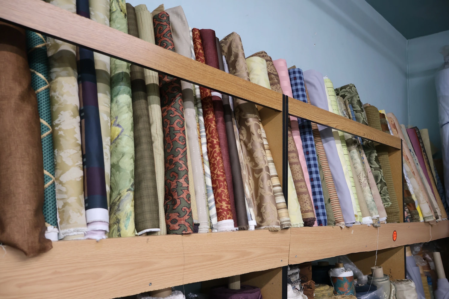 High-quality cotton blend fabric with geometric pattern in earth tones available in 45, 60, and 120 inch widths